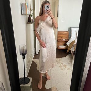 Slip dress with feathers